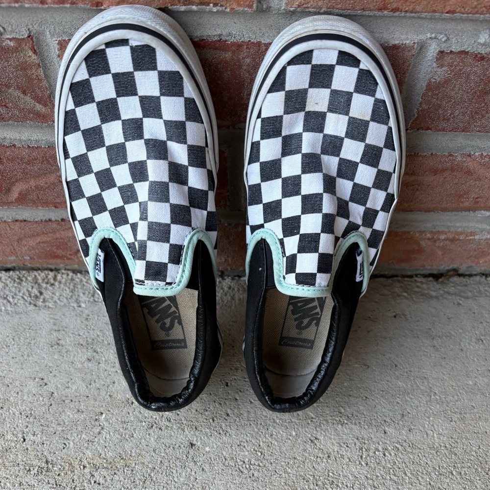 Vans women’s Black and White Checkered Slip-On Sneakers